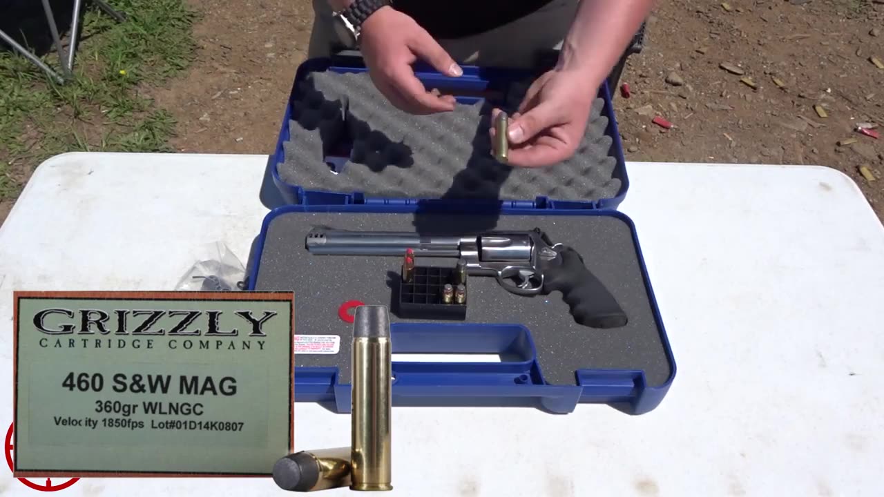 A Grizzly Cartridge Company 460 S&W Mag 360-grain box shown next to the 460XVR in its case while a round is held up for the camera
